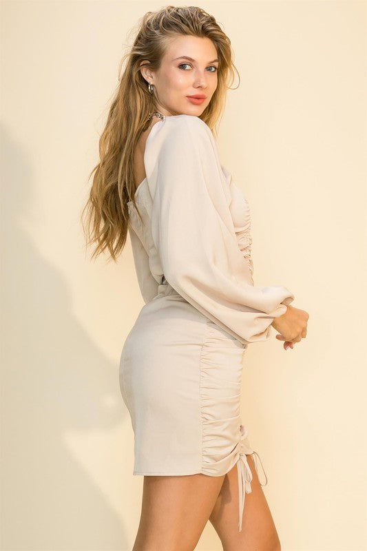 Ruched mini dress with tie-hem, square neckline, elasticized shoulders and fitted silhouette — chic and flirty for evening wear