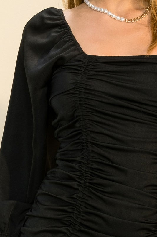 Ruched mini dress with tie-hem, square neckline, elasticized shoulders and fitted silhouette — chic and flirty for evening wear