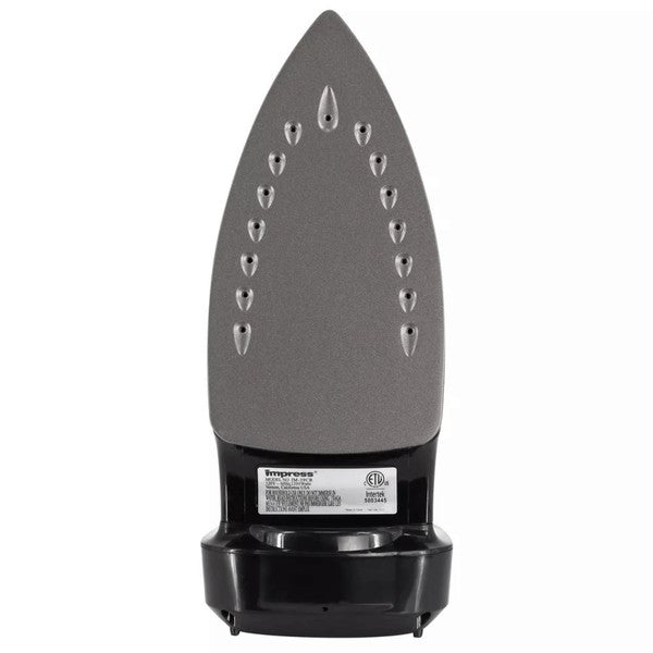 Black Impress steam iron standing upright with a temperature dial, steam control knob, and red indicator light—next to a small transparent measuring cup.