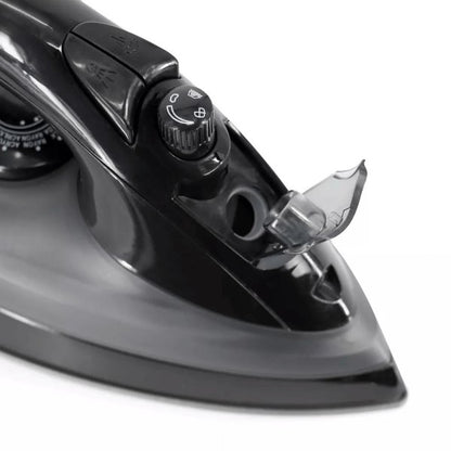 Close-up of a black and gray steam iron showing its steam control dial, open water inlet, spray and steam burst buttons, and pointed soleplate for precision ironing.