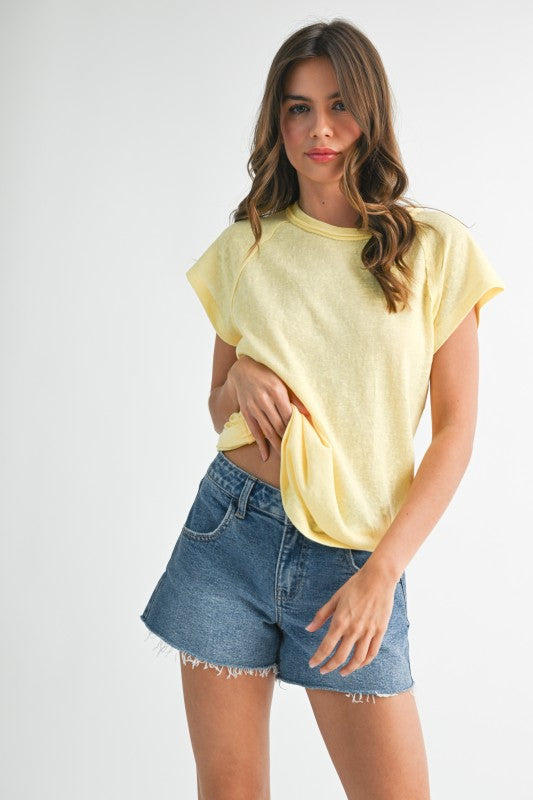 Relaxed shoulders enhance the laid-back vibe.