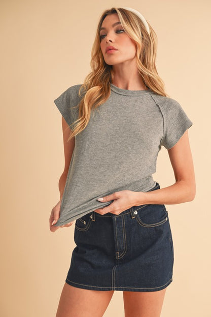 Cropped boxy cut pairs well with high-waisted bottoms.