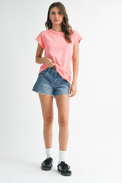 Can be styled tucked, knotted, or layered.