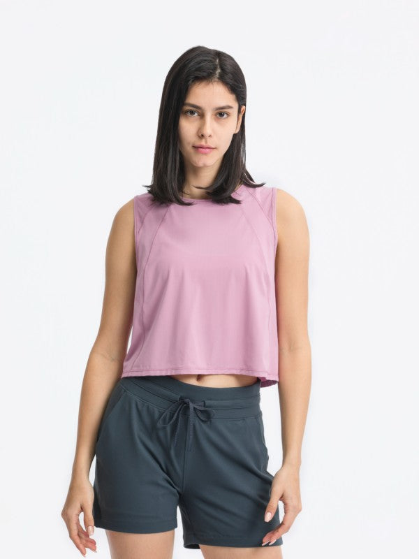 Flattering fit. Effortless style. The JupiterGear Round-Neck Cropped Tank is your new go-to for workouts, layering, and laid-back days. With a clean round neckline and a cropped silhouette that hits just right, this tank blends sporty function with everyday fashion.