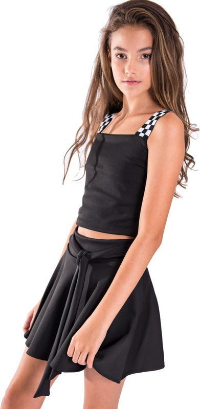 Kids crop top with black-and-white checkerboard elastic straps and square neckline — snug fit, breathable fabric, ideal for summer wear