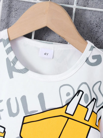 Children's t-shirt with cartoon design on a hanger against a textured wall.