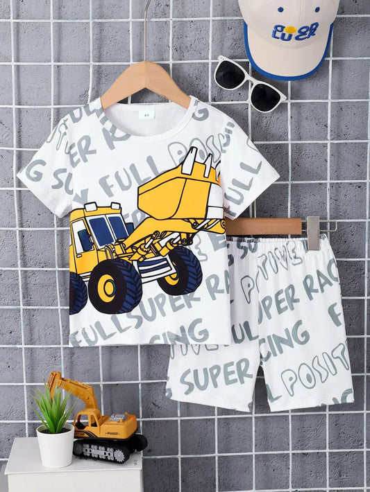 Children's outfit with a bulldozer design on a hanger against a tiled wall.