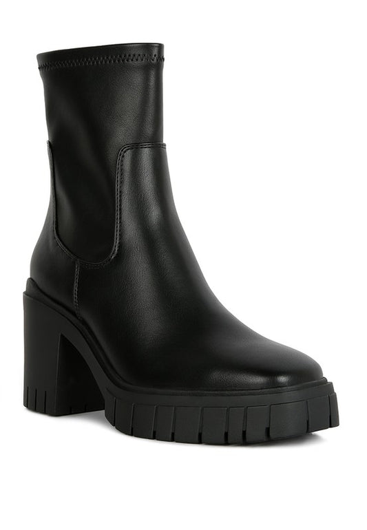 Black leather ankle boot with a chunky platform heel.