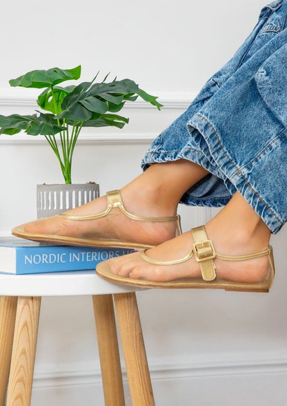 Jelly sandals featuring ankle strap with buckle closure, rounded closed-toe cut, thick flatform sole, slip-on style