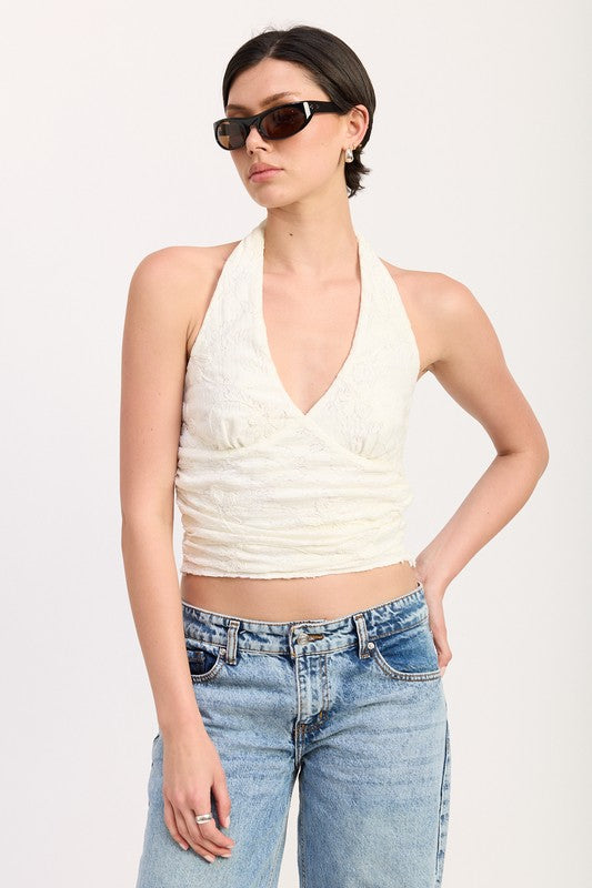 Halter neckline that ties or hooks behind the neck for a flattering, open-shoulder look.