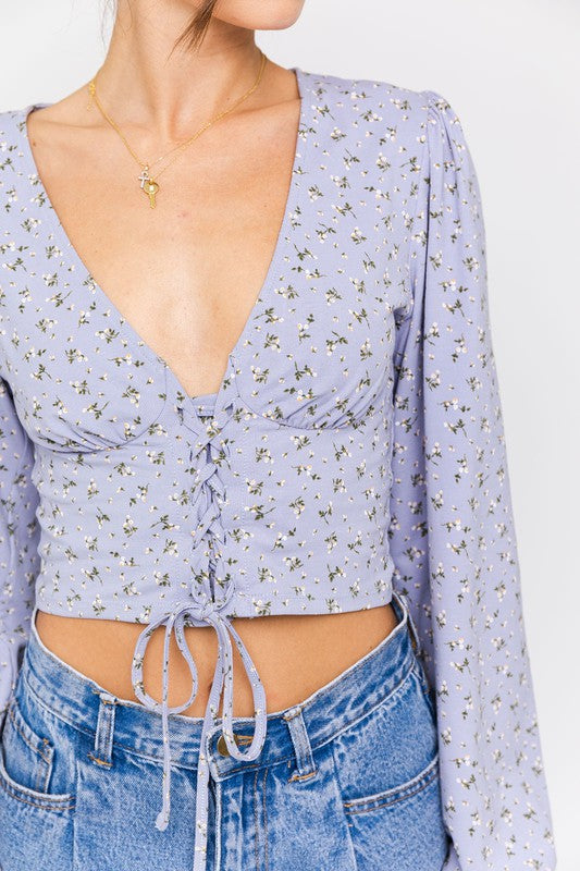 Decorative lace-up ties enhance the neckline without compromising comfort.