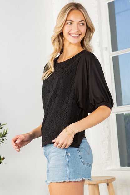 Romantic lace and structured sleeves meet to create a flattering, standout top.