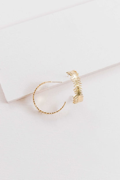 These Leaf Wreath Hoop Earrings feature a delicate arrangement of leaves—some adorned with shimmering crystals—forming a graceful wreath around your earlobe. Whether you’re dressing for brunch, a garden party, or a romantic evening, these hoops bring a touch of organic beauty to any look.