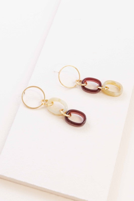 Ready to turn heads? These earrings are your new go-to for effortless glam. The Let’s Link Up Dangle Earrings feature a chic trio of gold, maroon, and beige links that dance with every move. Whether you're brunching with besties or dressing up date night, these beauties bring just the right touch of sparkle and sass.