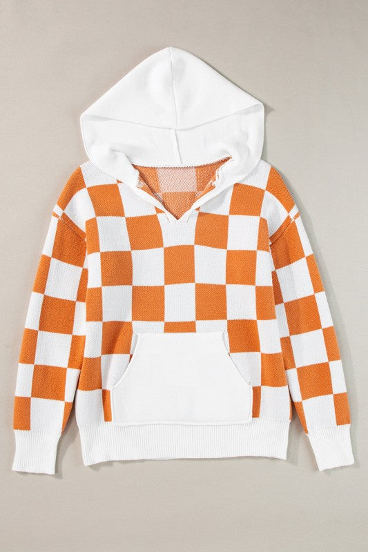 Orange and white checkered hooded sweater, featuring a kangaroo pocket and a ribbed hem and cuffs.