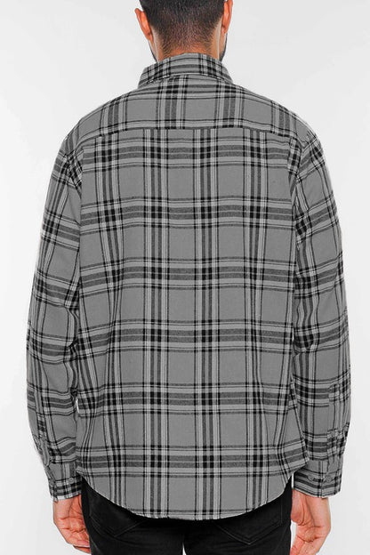 This long-sleeve flannel shirt features a full plaid checkered pattern with a cozy, classic look.