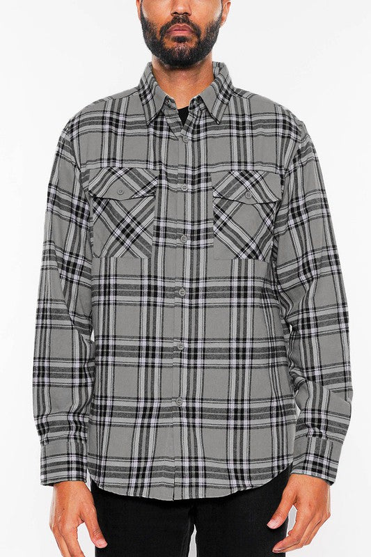 This long-sleeve flannel shirt features a full plaid checkered pattern with a cozy, classic look.