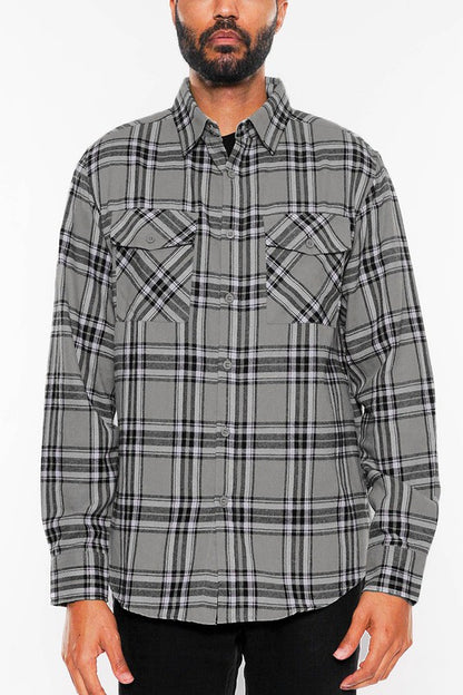 This long-sleeve flannel shirt features a full plaid checkered pattern with a cozy, classic look.