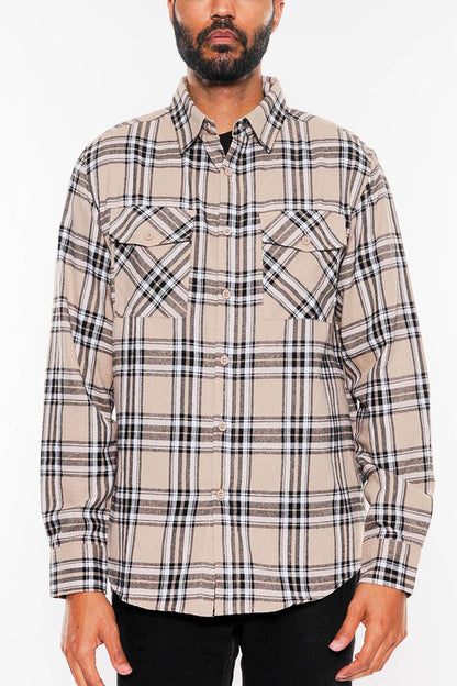 This long-sleeve flannel shirt features a full plaid checkered pattern with a cozy, classic look.