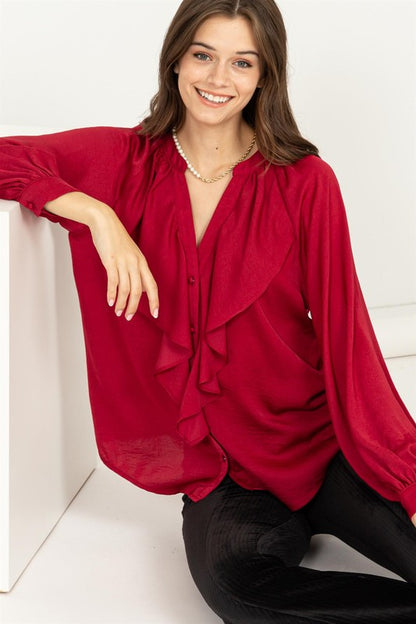 Soft ruffle trim around the neckline adds a romantic, feminine touch.