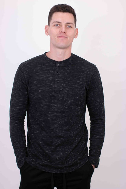 A versatile long-sleeve Henley tee that combines casual comfort with timeless style, featuring a buttoned placket and soft, breathable fabric for everyday wear.

