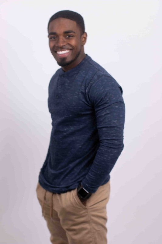 A versatile long-sleeve Henley tee that combines casual comfort with timeless style, featuring a buttoned placket and soft, breathable fabric for everyday wear.

