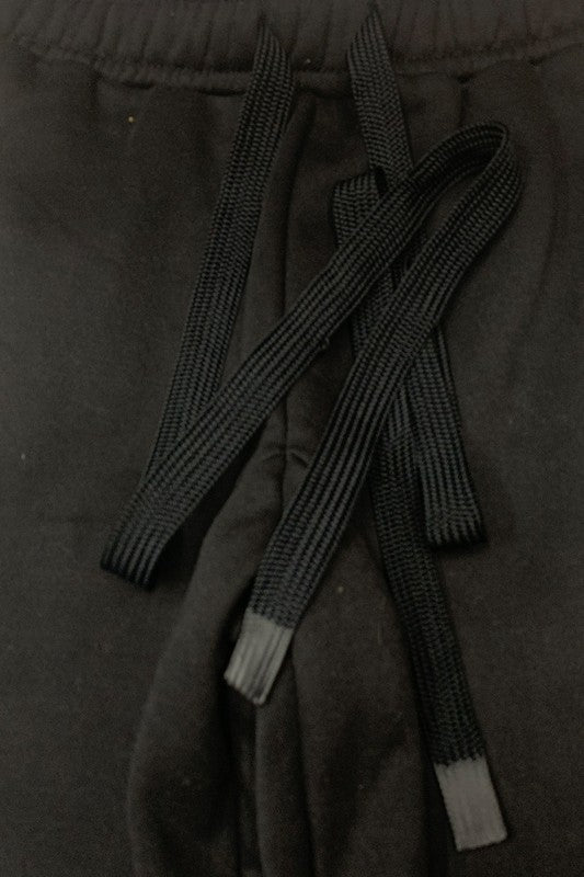 These sweatpants are the definition of cozy confidence. Made from thick, breathable cotton fleece, they deliver warmth without the bulk—perfect for cool mornings, laid-back weekends, or post-workout recovery. The soft interior feels like a hug, while the elastic waistband with drawstring gives you a secure, adjustable fit.