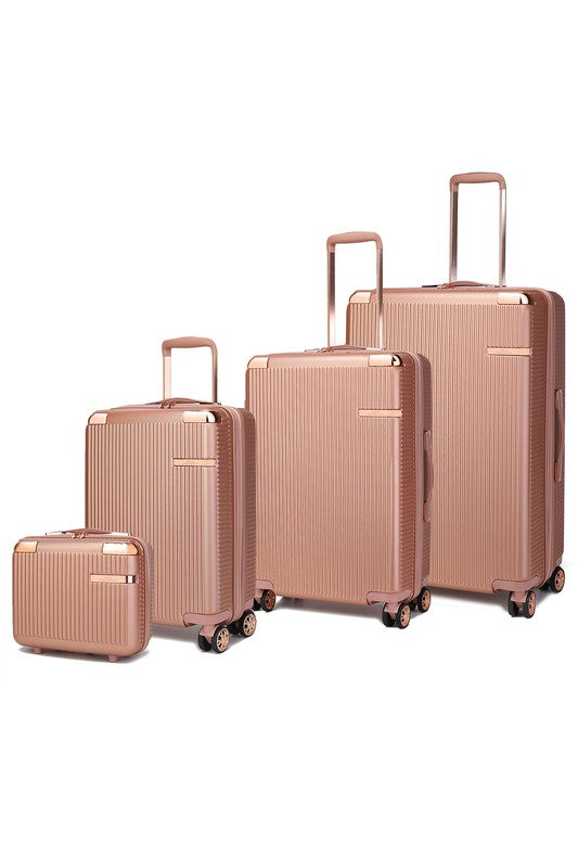 Four-piece hardshell luggage set in varying sizes, featuring a vertical ribbed texture and spinner wheels.