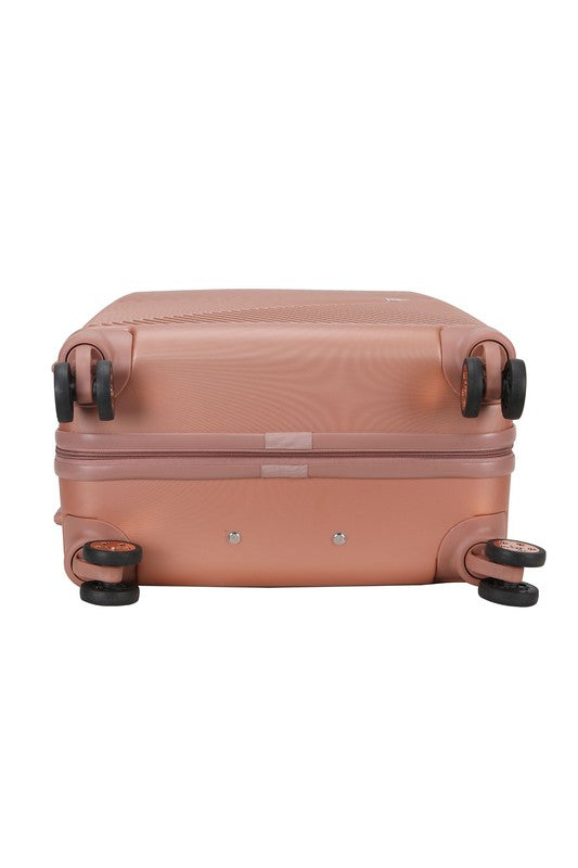  durable hardshell suitcase with a modern geometric textured design and spinner wheels.