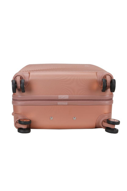  durable hardshell suitcase with a modern geometric textured design and spinner wheels.