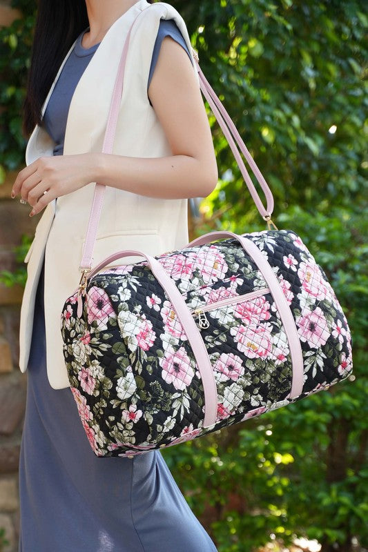 Floral quilted travel carry-on in a sleek color, offering comfortable and chic transport.