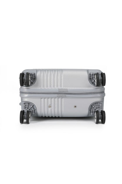 Durable hardshell luggage with a modern ribbed texture and smooth-rolling spinner wheels.