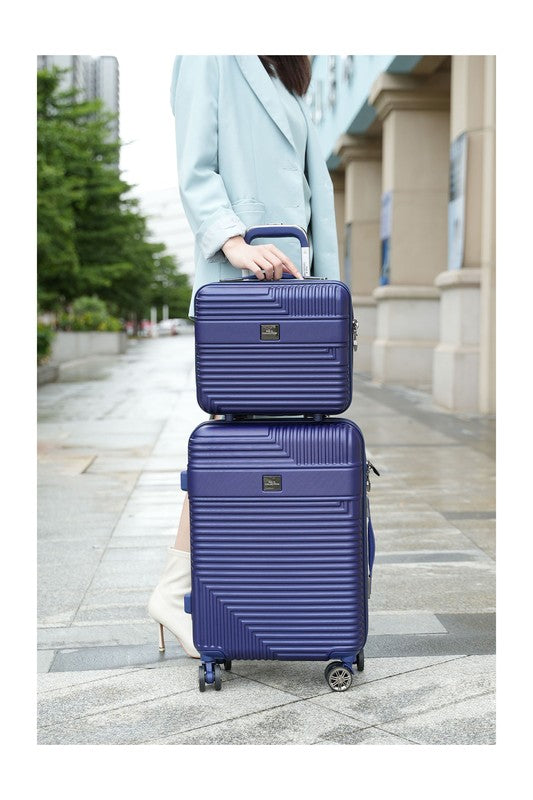a two-piece hardshell luggage set stacked on a sidewalk, featuring a textured design and spinner wheels.