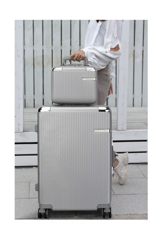 Two-piece hardshell luggage set in varying sizes, featuring a vertical ribbed texture and spinner wheels.