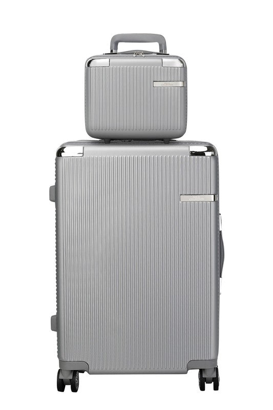 two-piece hardshell luggage set stacked on a sidewalk, featuring a textured design and spinner wheels.