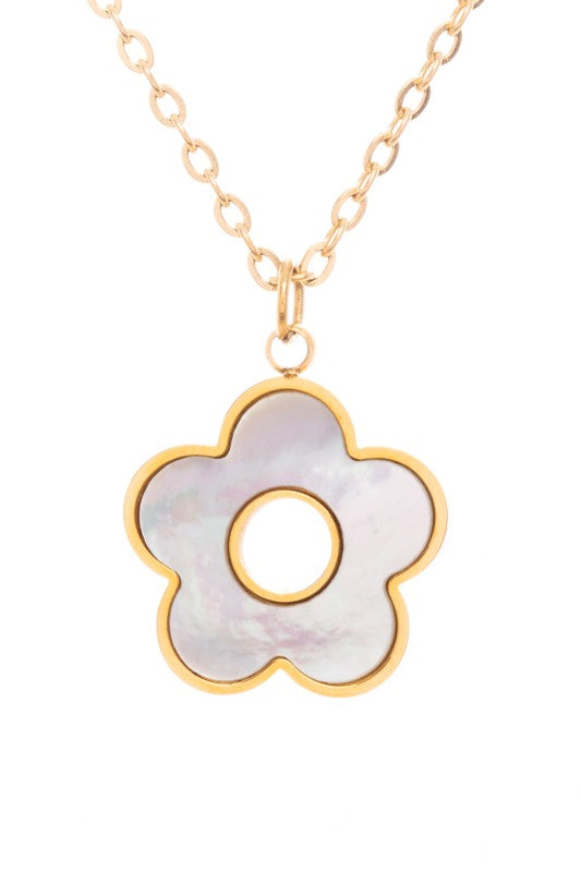 A gold necklace with a flower-shaped pendant. The pendant has a mother-of-pearl-like center with a gold outline and a circular cutout in the middle.