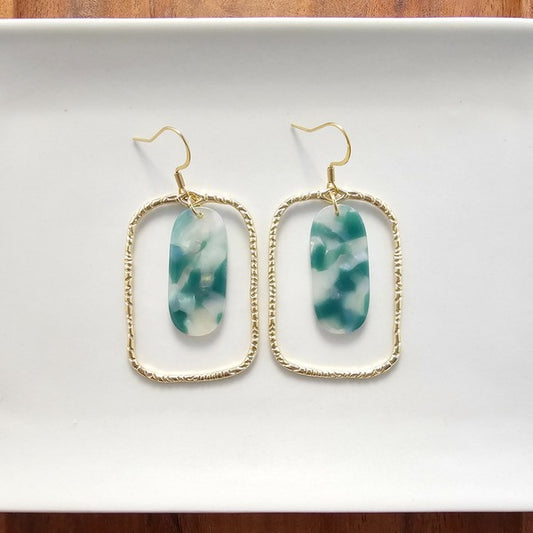 Grace in every glance. The Madison Earrings are a delicate fusion of earthy jade tones and dreamy opal shimmer. Designed for the modern romantic, these earrings bring a quiet luxury to your everyday look—refined, radiant, and effortlessly you.