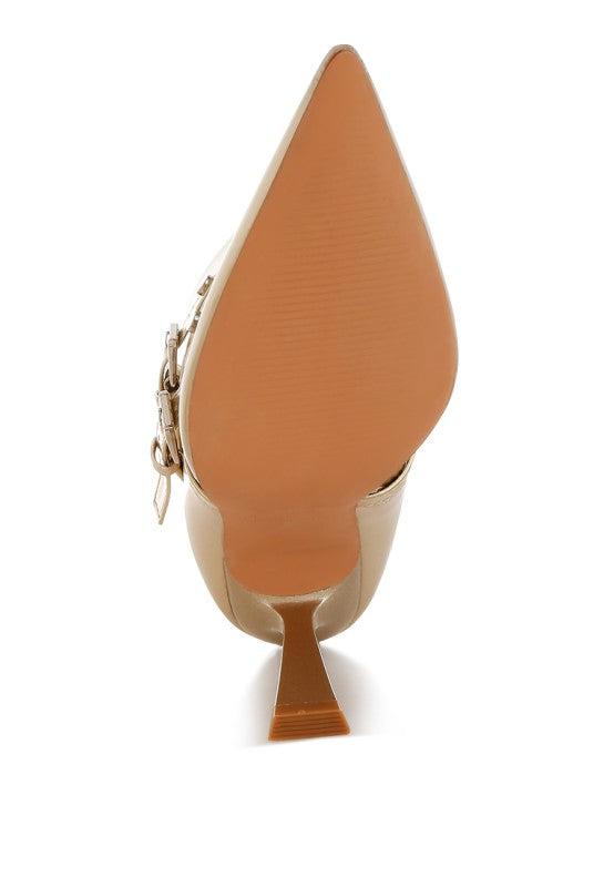 Close-up of a shoe with a pointed heel on a white background