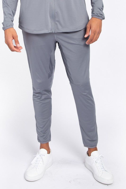 These active bottoms are designed for motion and style. With a tapered leg that adds a modern edge, they deliver a clean silhouette while keeping things flexible and functional. Made from a lightweight polyester-spandex blend, they offer breathability and stretch for workouts, errands, or everyday wear.