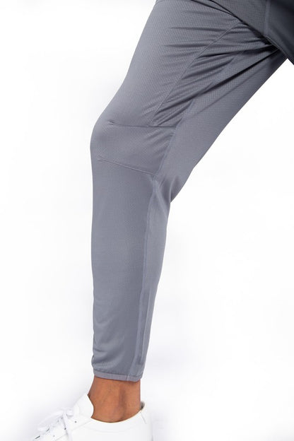 These active bottoms are designed for motion and style. With a tapered leg that adds a modern edge, they deliver a clean silhouette while keeping things flexible and functional. Made from a lightweight polyester-spandex blend, they offer breathability and stretch for workouts, errands, or everyday wear.