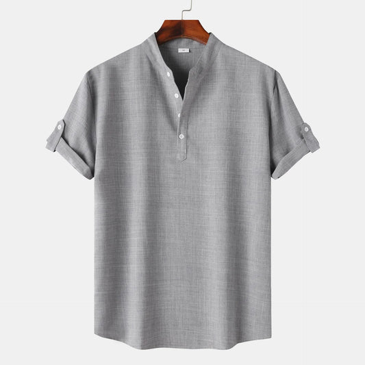 Gray short-sleeve shirt on a hanger against a white background