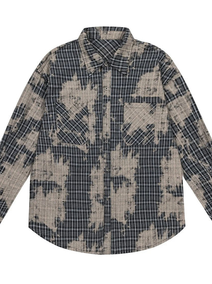 This men's button-down shirt features a distressed plaid pattern for a rugged, casual look and versatile wear.

