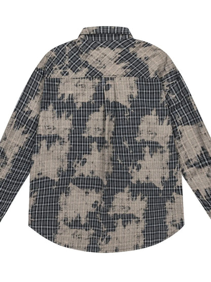 This men's button-down shirt features a distressed plaid pattern for a rugged, casual look and versatile wear.