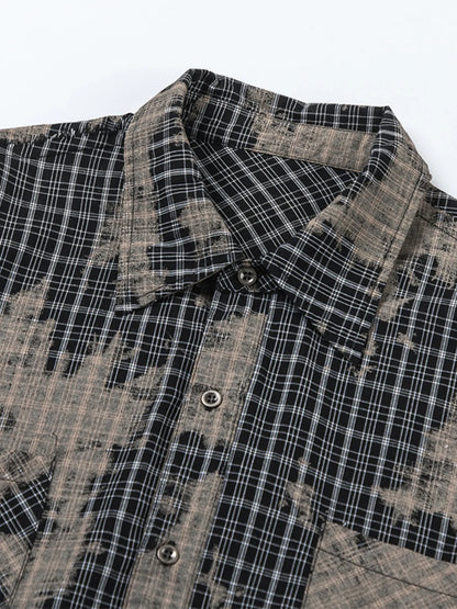 This men's button-down shirt features a distressed plaid pattern for a rugged, casual look and versatile wear.