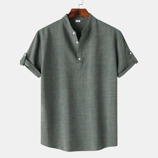 Gray short-sleeve shirt on a hanger against a white background