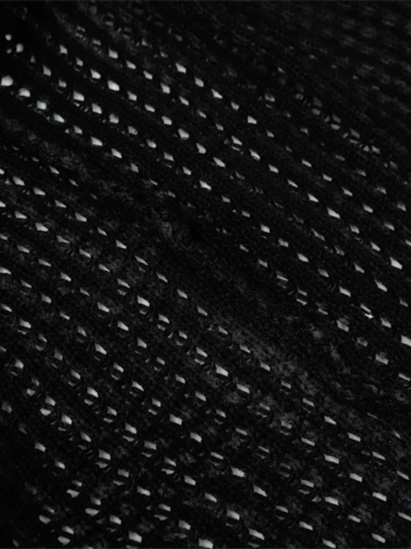 A stylish men’s distressed knit vest featuring intentionally frayed edges for a rugged, contemporary look.