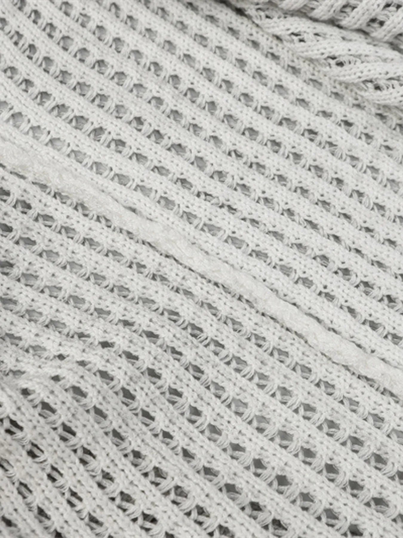 A stylish men’s distressed knit vest featuring intentionally frayed edges for a rugged, contemporary look.

