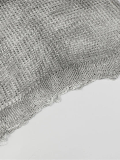 A stylish men’s distressed knit vest featuring intentionally frayed edges for a rugged, contemporary look.