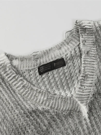 A stylish men’s distressed knit vest featuring intentionally frayed edges for a rugged, contemporary look.