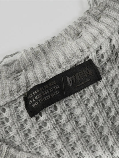 A stylish men’s distressed knit vest featuring intentionally frayed edges for a rugged, contemporary look.